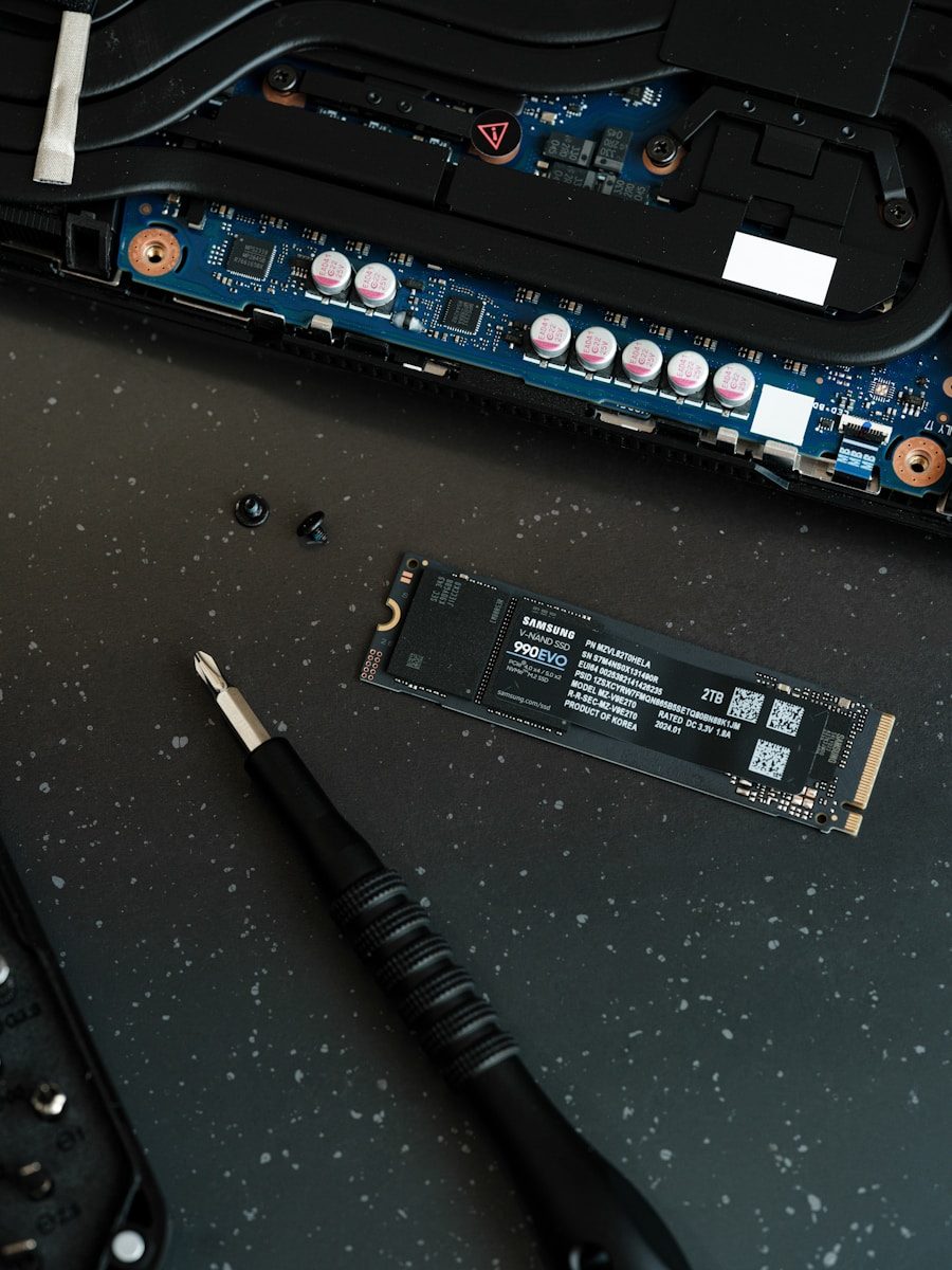 A close up of a motherboard and a pen on a table